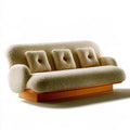 Canapé beige texturé à trois coussins et base orange